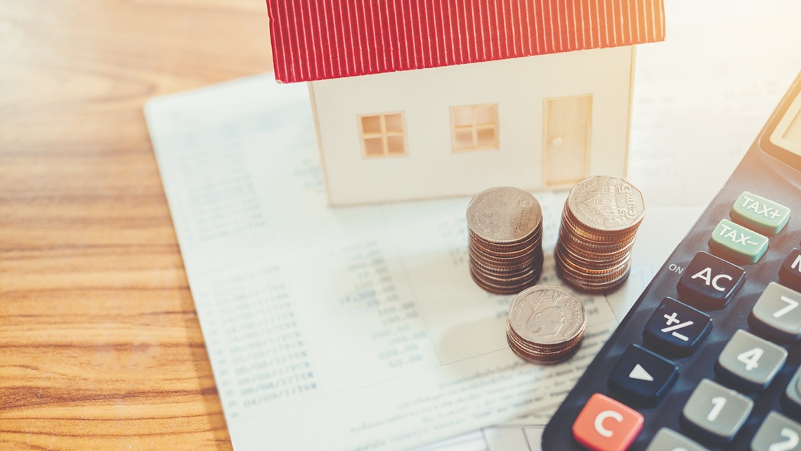 Calculator and coins,budgeting to buy a home | BetterBond