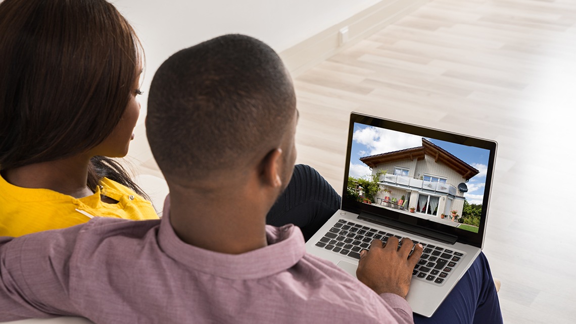 Couple viewing houses on a laptop | BetterBond