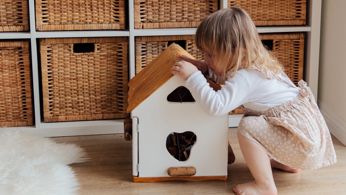 Little girls playing with doll house | BetterBond